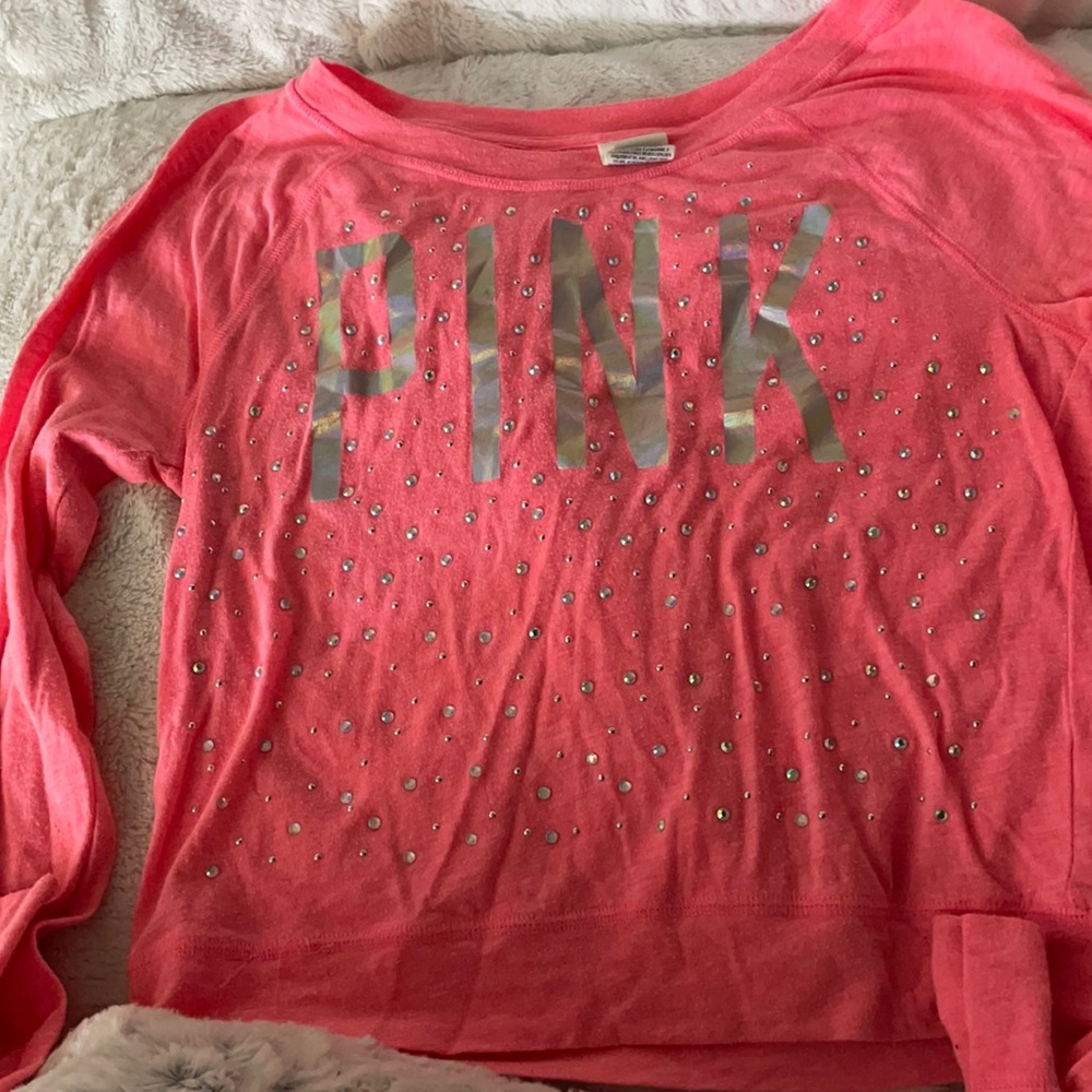 A long-sleeve Pink shirt